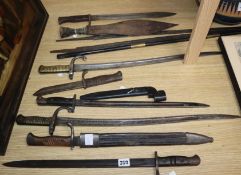 Eight 19th / 20th century bayonets and two sword blades