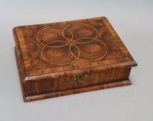 A laburnum veneered glove box 28 x 22cm