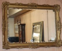 A moulded gilt mirror W.87cm