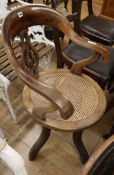 A Victorian caned desk chair