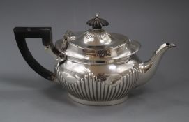 A late Victorian demi fluted silver teapot, Sheffield, 1896, gross 12.5 oz.