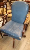A blue leather office swivel chair