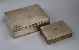 Two 1930's silver cigarette boxes including engine turned, largest 17.8cm.