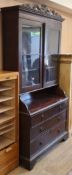 A Victorian mahogany four drawer bookcase W.122cm