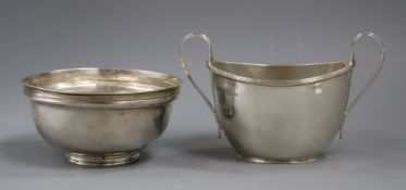 An Edwardian silver sugar bowl, London, 1907 and a George V silver two handled sugar bowl, 12.5 oz.