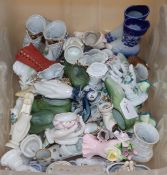 A large collection of Victorian and later ceramic novelty shoes and hands (50 plus)