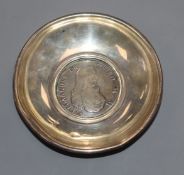 A silver coin dish