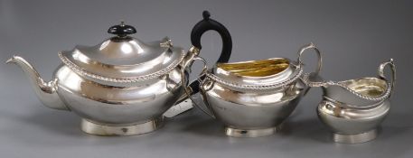 A George V silver three piece silver tea set by Edward Barnard & Sons, London, 1918/9, gross 35 oz.