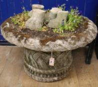A reconstituted stone garden urn W.90cm approx.
