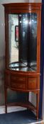 An Edwardian Sheraton revival floral painted satinwood corner display cabinet H.182cm