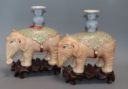 A pair of Chinese elephant censers, on wooden censers height 24cm