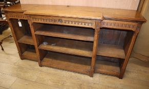 An oak open breakfront bookcase W.174cm