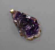 A 18k yellow metal mounted amethyst quartz carved 'rose' pendant, 36mm.