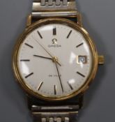 A gentleman's gold plated Omega De Ville manual wind wrist watch, on associated bracelet.