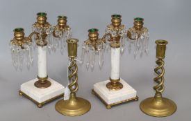 A pair of three branch brass and marble lustre drop candlesticks and a pair of brass twist stem