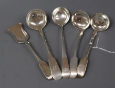 Four assorted Victorian Scottish silver toddy/cream ladles and a similar spoon with shovel shaped