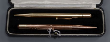 A Mabie Todd & Co. 'Fyne Point' 9ct rose gold propelling pencil and a similar gold-plated pencil.