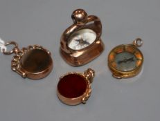 A carnelian set pinchbeck watch fob, two 9ct gold bloodstone/carnelian fobs and a 9ct gold compass