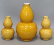 Three Chinese yellow ground vases Tallest 35cm