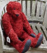 A scarlet plush show teddy bear
