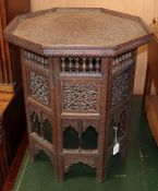 A carved wood Benares table W.56cm