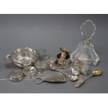 A collection of small silver items including a boxed Harrods sterling bottle stopper, an engraved