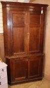 An oak corner cupboard H.212cm