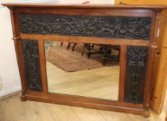 A carved oak mirror W.130cm