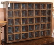 A teak pigeon hole chest W.100cm