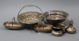 An embossed silver basket, a sterling weighted bowl, a pair of silver 'trug' dishes and three