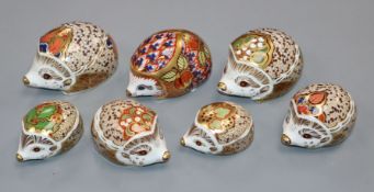 A collection of seven Royal Crown Derby hedgehog paperweights
