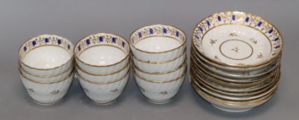 A set of 18th/19th century English tea bowls and saucers (ten of each), of fluted form, decorated