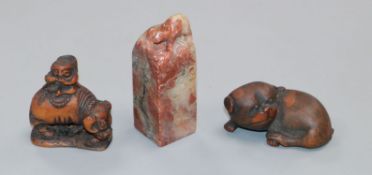 Two Japanese carved wood netsuke and a Chinese soapstone seal