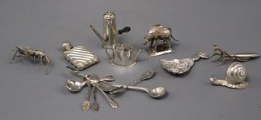 A Victorian silver caddy spoon, a similar silver miniature 'chocolate pot' pepperette and teapot and