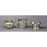 Three assorted George V silver cream jugs, 11 oz.