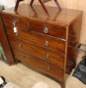 A George III mahogany chest fitted two short drawers and three graduated long drawers on outswept