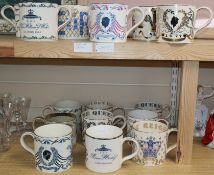 A collection of sixteen commemorative Wedgwood mugs designed by Richard Guyatt