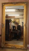 A large gilt-framed mirror H.218cm
