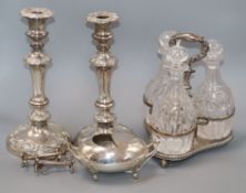 A quantity of plated wares including a pair of candlesticks