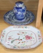 A Chinese famille rose meat platter and four items of blue and white, including a circular plate