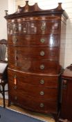 A George III mahogany bow front tallboy of Sheraton style, two short and six long drawers W.120cm