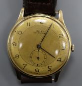 A gentleman's yellow metal Doxa manual wind wrist watch, with subsidiary seconds, on leather strap