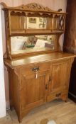 An Arts and Crafts oak side cabinet W.122cm