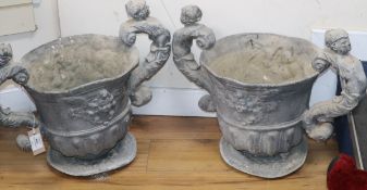 A pair of lead garden urns, with figural scroll handles W.55cm approx
