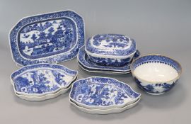 Four Chinese blue and white leaf-shaped plates, three matching rectangular serving dishes and a