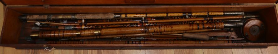 A cased group of bamboo cane fishing rods