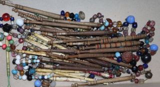 A group of bone and wood lacemaking bobbins