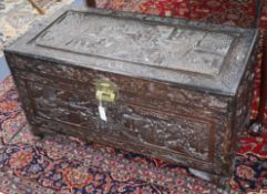 A Chinese carved camphorwood chest W.101cm