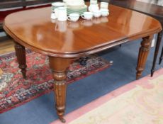 A Victorian mahogany extending dining table, on turned fluted legs 238cm extended (two spare