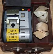 A Gibson A14 London bus ticket machine and a Swedish AB Almex ticket machine, both in fitted leather